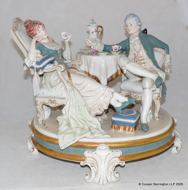 Royal Dux Large Porcelain Figure group, 'The Tea Party'. Impressed marks 1959 with Pink Triangle mark to the base.  Height 33 cm  Width 38 cm.